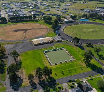 Two sporting ovals, one with surface upgrades and the other green and being used by the community