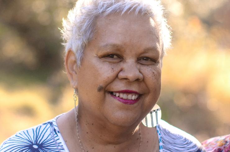 Author and historian Dr Jackie Huggins AM smiling at the camera.